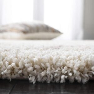 Elevate Your Interior with the Grey and White Square Pattern Shaggy Carpet