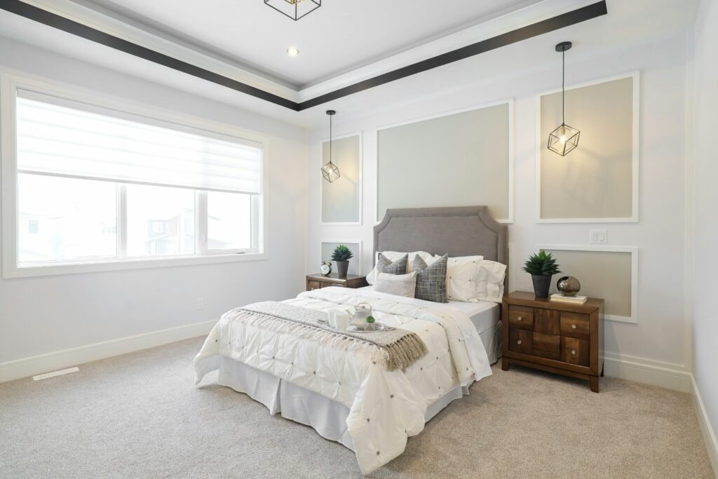 7 Smart Carpet on Carpet Bedroom Ideas for Layering Rugs 4 Layered carpets showcasing a mix of textures and patterns for a modern bedroom.