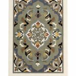 Aveloire hand tufted floral medallion carpet with sage green, dusty blue, cream, ochre, rust, and black details