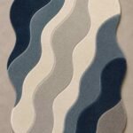 Nerivelle hand tufted irregular rug with flowing navy blue, slate blue, gray and ivory wave-shaped sections